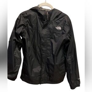 The North Face Boys Black Windbreaker w/ Hood Windbreaker w/ Hood.
Preowned